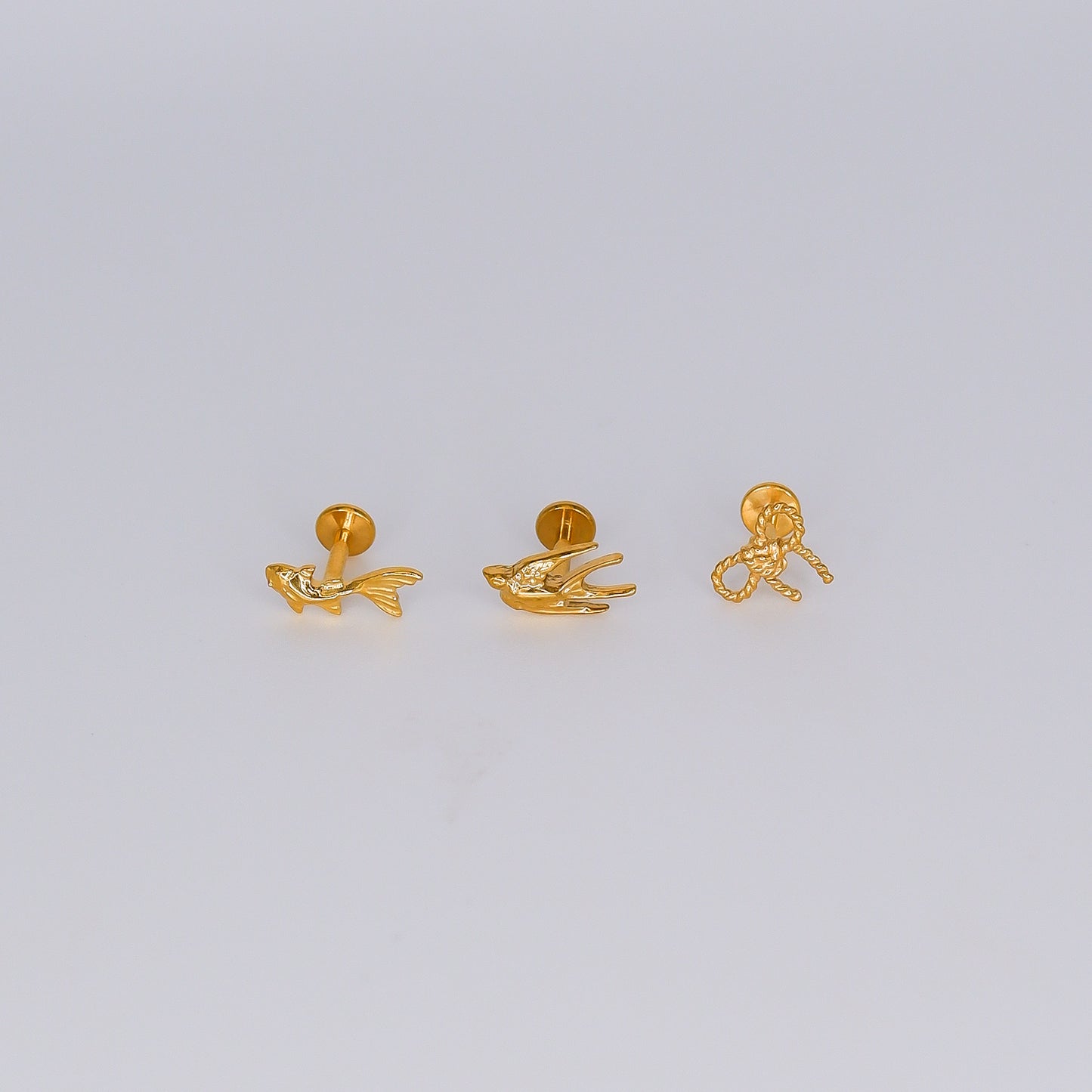 Piercing Achatado Andorinha, Peixe e Laço