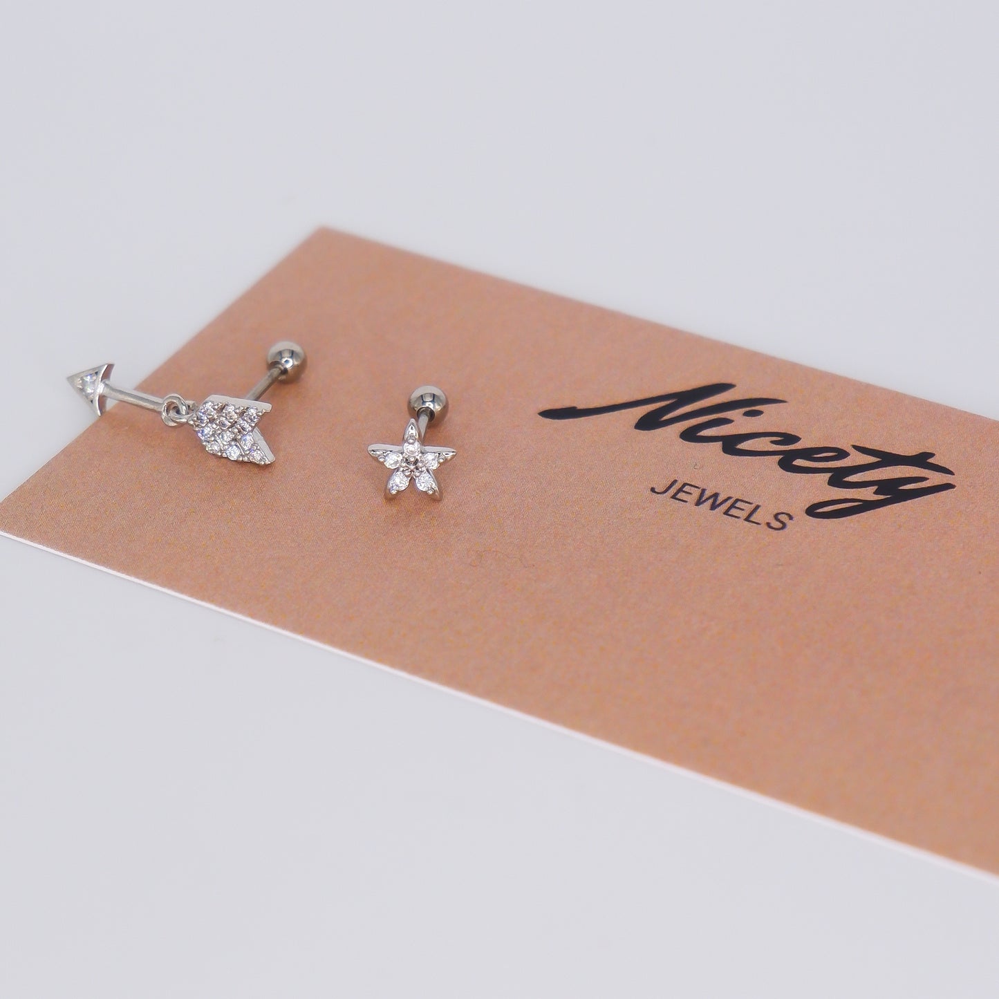 Piercing Bolinha Aço Inoxidável Seta e Flor